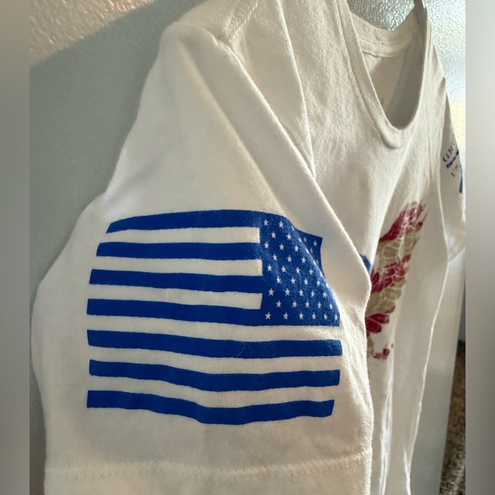 Women’s Grunt Style White Graphic Tee Size M
#0013 - Picture 3 of 5